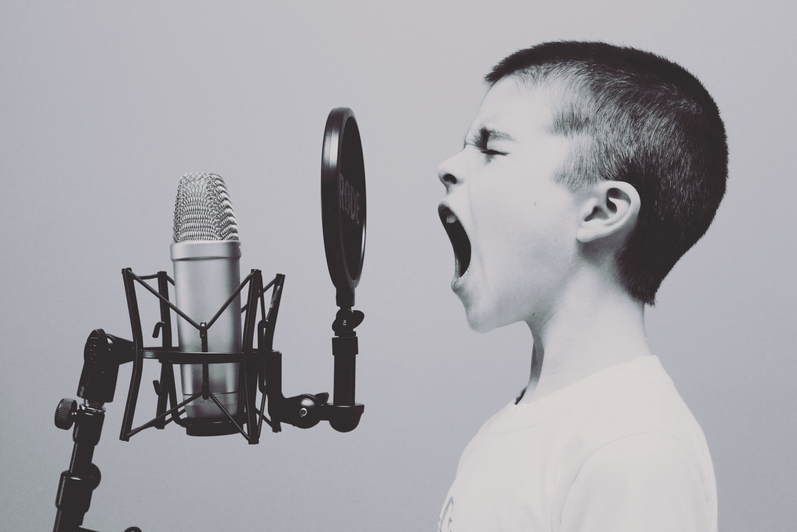 boy shouting into a microphone